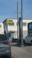 Cars at intersection in Laval on sunny afternoon