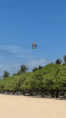 Colorful ship kite flies over Bali beaches