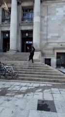 Barcelona afternoon: handstand performer and beachgoers captured simultaneously