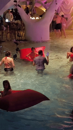 Evening festivities unfold at Kediri nightclub with pools and sculpture