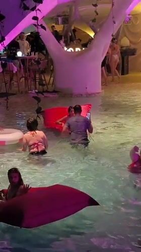 Evening festivities unfold at Kediri nightclub with pools and sculpture