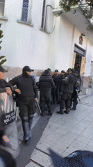 Riot police gather outside building in La Paz