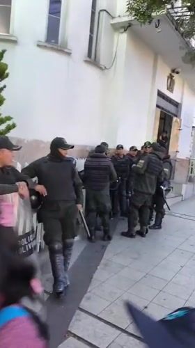 Riot police gather outside building in La Paz