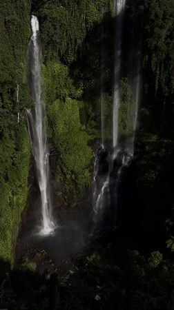 Multi-tiered jungle waterfall in Sawan, Indonesia, from above and below