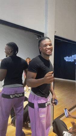 Young man filmed smiling in Lekki studio setting