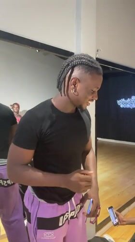 Young man filmed smiling in Lekki studio setting