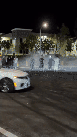 Car performs donuts for spectators in Santa Clarita