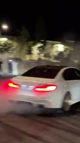 Car performs donuts for spectators in Santa Clarita