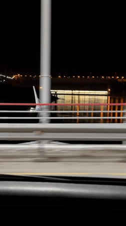 Nighttime bridge crossing captured on video in Divnogorsk, Russia