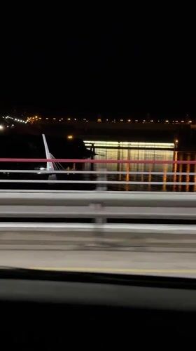 Nighttime bridge crossing captured on video in Divnogorsk, Russia