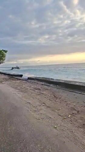 Peaceful coastal sunset captured at Nusa Penida seawall