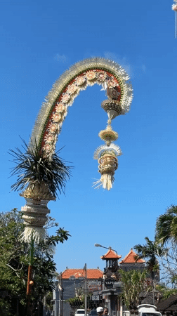 Bali street life: traffic, café, trinkets, and ceremonial décor