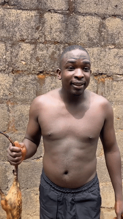 Man prepares traditional meat dishes in Rafin Bauna, Nigeria
