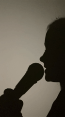 Girl with toy microphone, dog, mobile gaming captured domestically