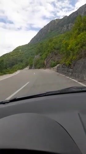Driver navigates mountain road in Bukovik, Montenegro