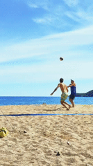 Beach volleyball game captured on sunny day in Budva