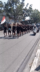 Multiple uniformed groups march through Tanjung Pinang streets