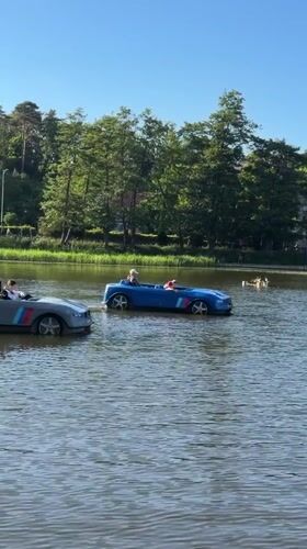 Summer afternoon leisure activities at Svetlogorsk lake with fountain