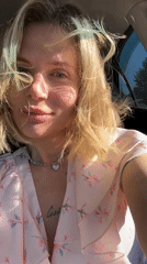 Woman in pink floral dress photographed in Mayma, Russia