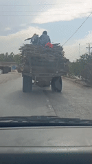 Mixed traffic flows through Sikandar Khel on cloudy morning