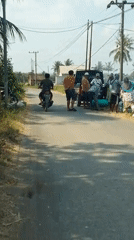 Morning street and stream life in rural Kloncing, Indonesia