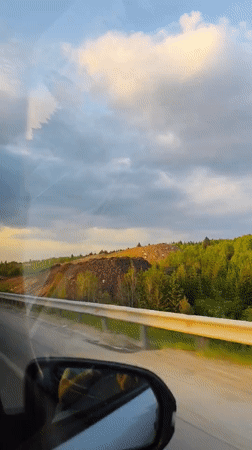 Highway construction documented along roadside in Perm, Russia