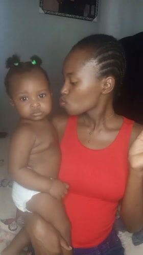 Mother and baby share tender moments in Keffi bedroom