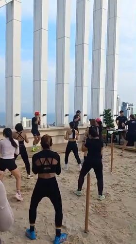 Boxing exercise class held on Pattaya rooftop with ocean views