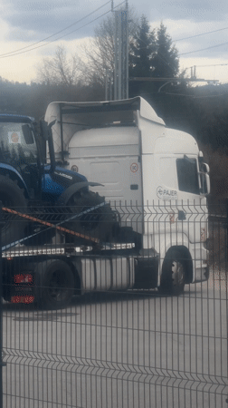 Agricultural tractors transported on flatbed truck in Slovenia