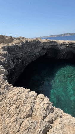 Aerial footage captures sea grotto in Malta's rocky cliffs