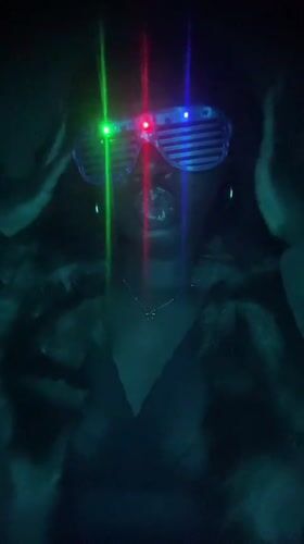 Person spotted wearing LED laser glasses in Nigeria nighttime gathering