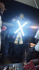 Nighttime gathering at outdoor venue in Tumfure, Nigeria