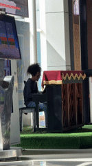 Late-night piano performance captured at Labuan Bajo airport