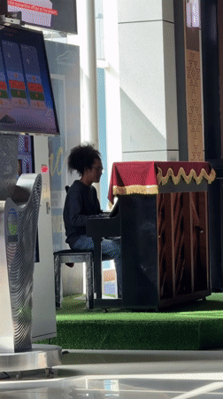 Late-night piano performance captured at Labuan Bajo airport