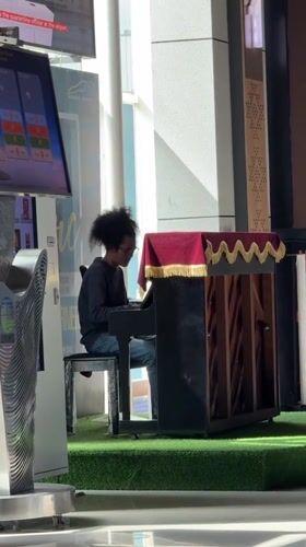 Late-night piano performance captured at Labuan Bajo airport