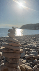 Stone stacking art created on Russian pebble beach