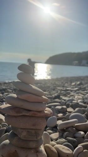 Stone stacking art created on Russian pebble beach