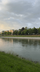 River scene with church spire filmed in Salzburg