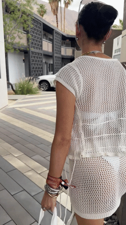 Woman in white dress observed walking in Palm Springs