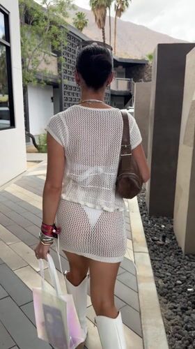 Woman in white dress observed walking in Palm Springs