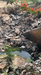 Daily life documented in Guzape: car washing, polluted drains