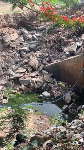 Daily life documented in Guzape: car washing, polluted drains