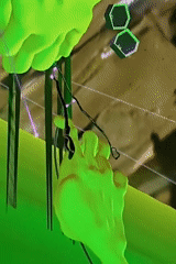 Green luminescent hand manipulates strings in captured video footage