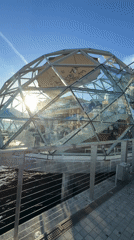 San Diego waterfront: dome, sailboat, and patio at sunset