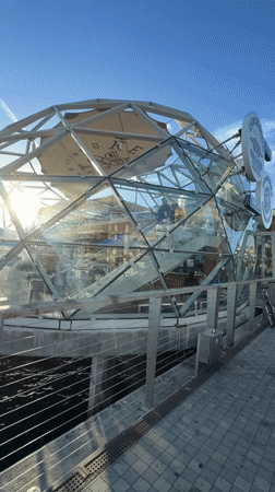 San Diego waterfront: dome, sailboat, and patio at sunset