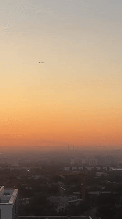 Almaty skyline glows during a warm summer sunset