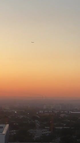 Almaty skyline glows during a warm summer sunset