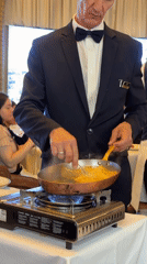 Waiter Alain performs tableside service at upscale Paris restaurant