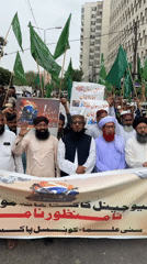 Religious procession marches through Karachi with flags and protest banners