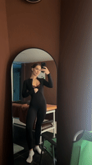 Woman takes mirror selfies in Irkutsk indoor location